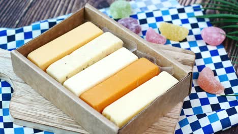 assorted cheeses and candies in a box