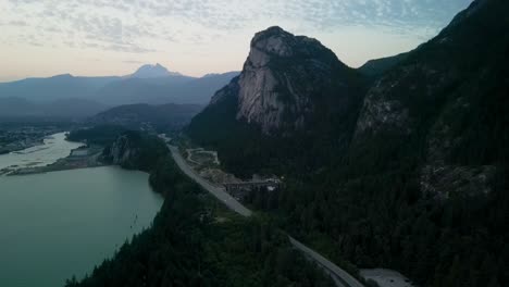 Aerial-descent-night-view-of-Stawamus-Chief-and-Squamish,-Canada