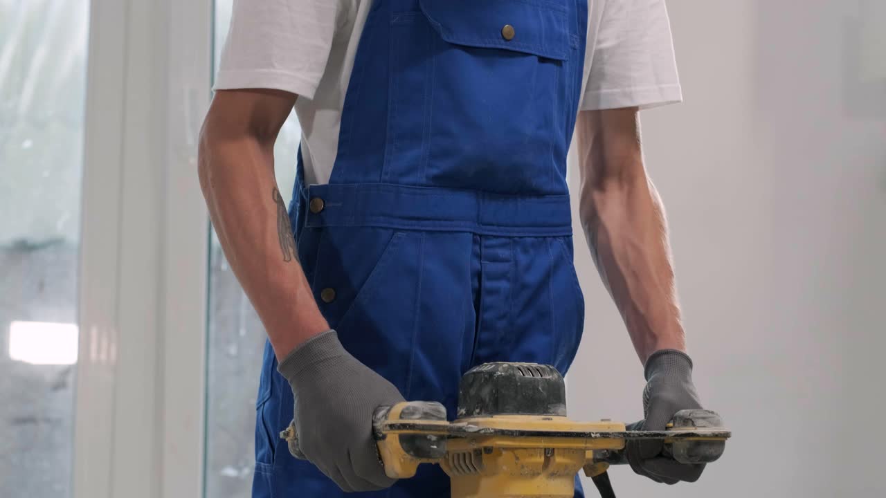 Installing ceramic floor tiles - measuring and cutting the pieces. Construction, renovation, repair apartment. Cuts tile. Tile cutting