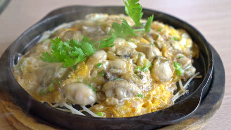 oyster omelette with bean sprout on hot pan - asian food style