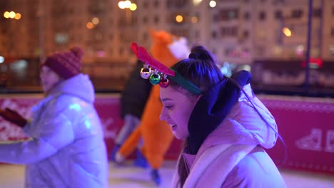 ice skating at night with christmas decorations