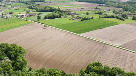 Cinematic-drone-footage-when-filming-beautiful-nature-and-road-where-car-is-passing