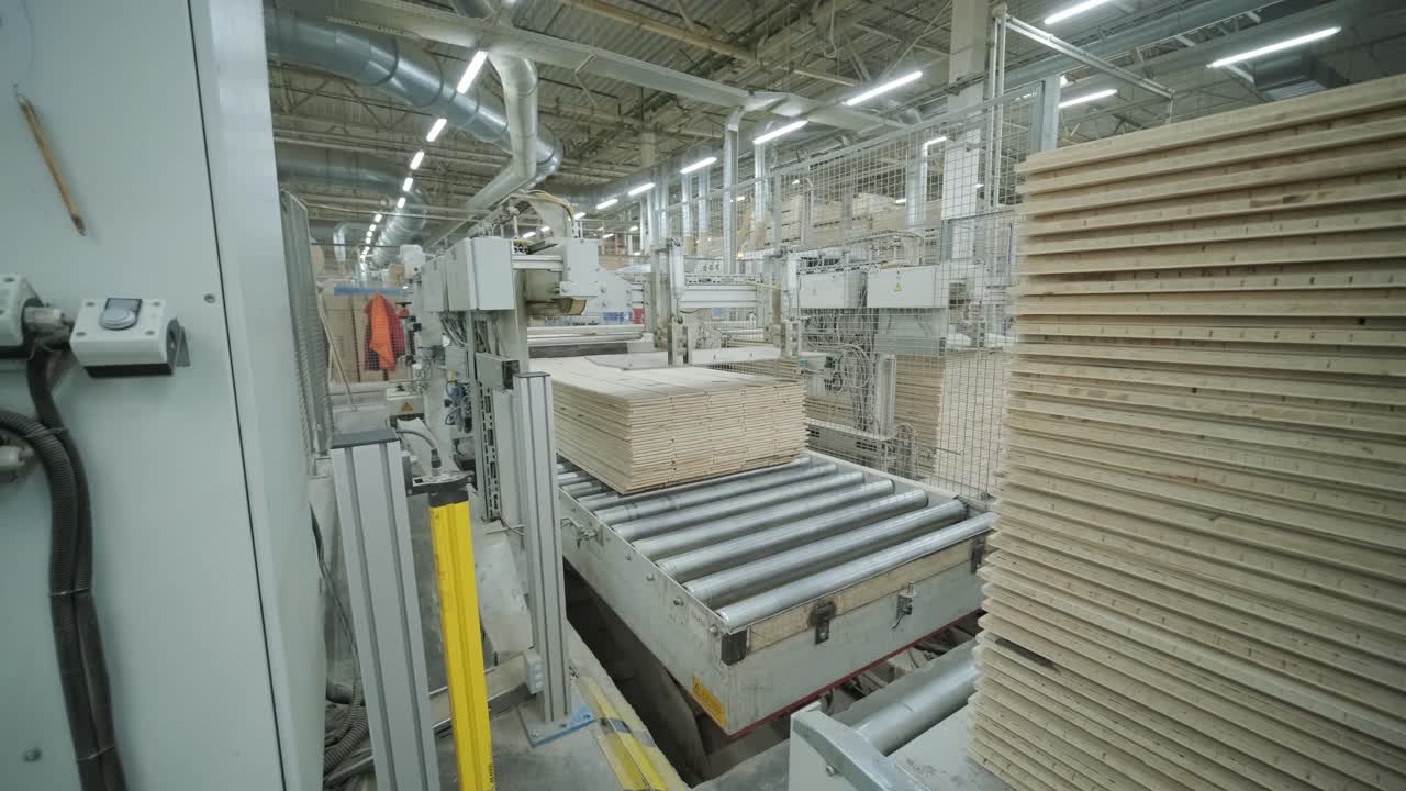 Automated Production Line Stacking Wooden Boards in a Modern Factory