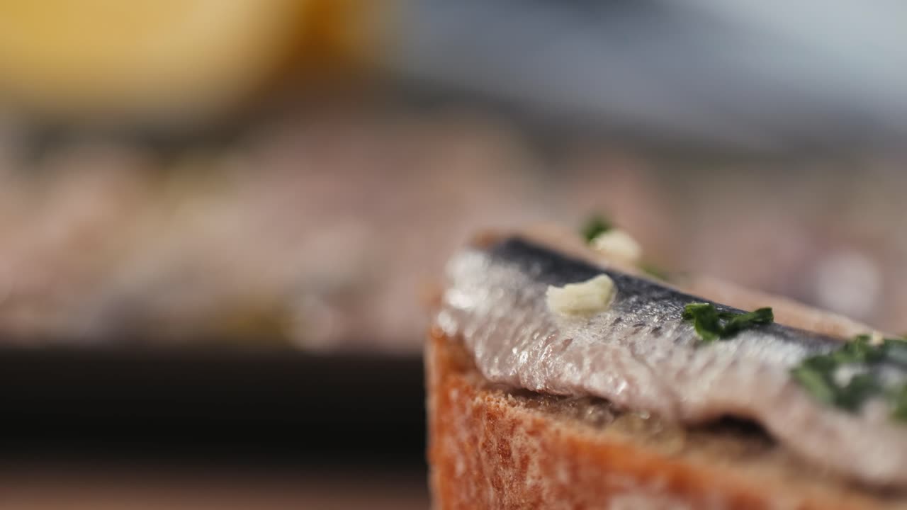 Fresh Sea sardines and Anchovy Fish and Mullus On Display On Ice On Market Store Shop. Seafood Fish Background, close up stand of small salty white fish.
