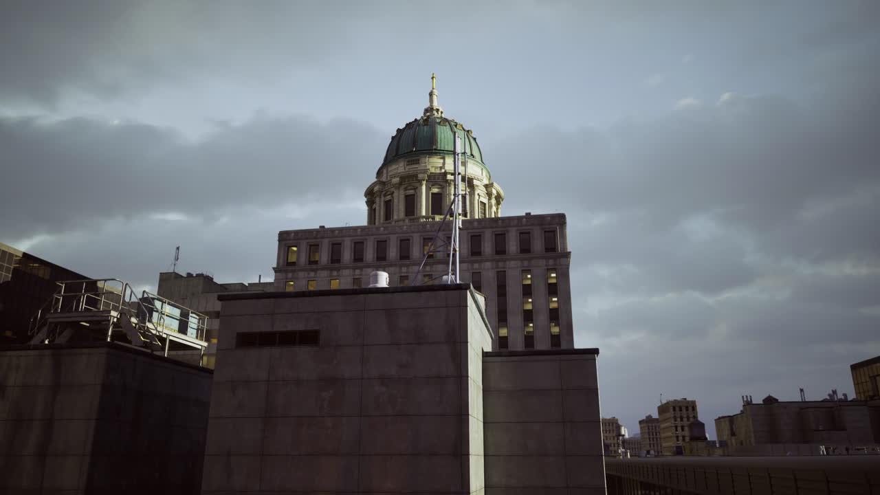 Historic building with dome under cloudy skies at dusk in urban setting