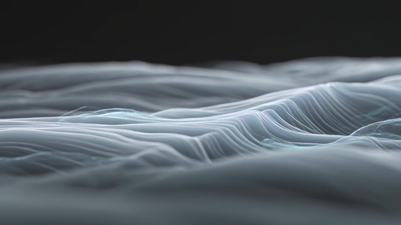 Telecamera in movimento che mostra nastri che ondeggiano per il movimento delle onde in studio, con una cresta che si forma con un bagliore ciano.