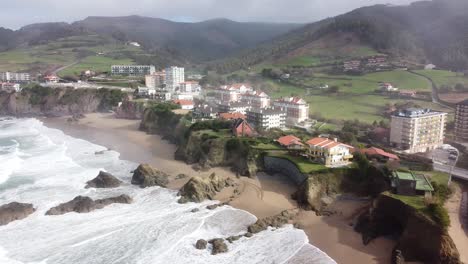 Aerial-drone-view-of-the-beach-of-Bakio-in-the-Basque-Country-in-a-foggy-day