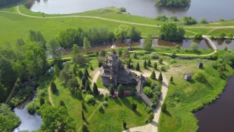 a drone glides over the mühlenmuseum gifhorn, showing the windmills from above and providing a breathtaking view of the site’s landscape.