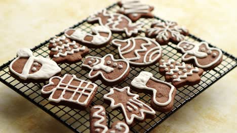 Fresh-baked-Christmas-shaped-gingerbread-cookies-placed-on-steel-grill