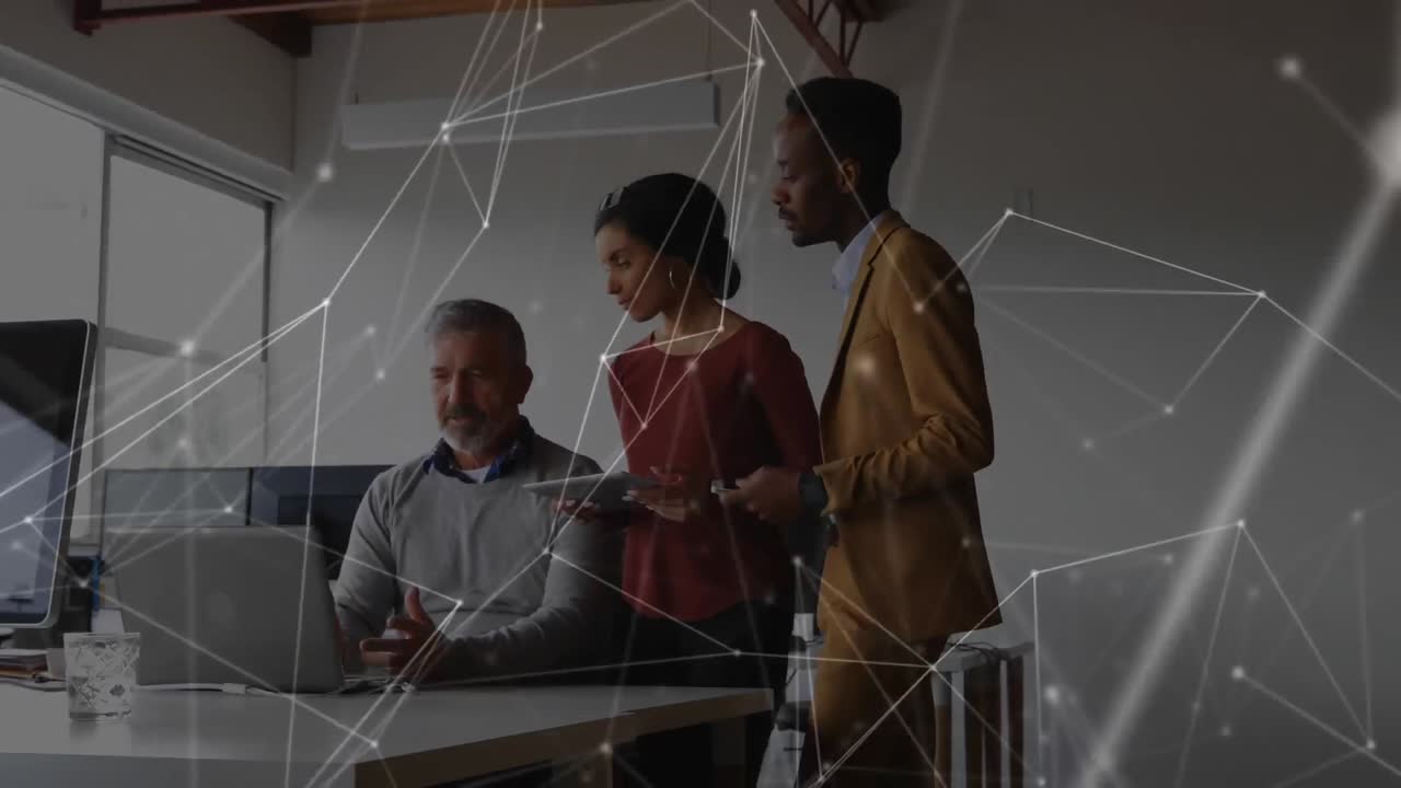 Web of connection icons against people working in office