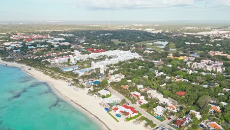 playa del carmen beach with resorts, villas, and turquoise sea, aerial view