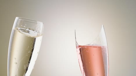 Slow-Motion-Shot-Toasting-with-Champagne-Glass-Breaking,-white-and-rose-Champagne-flute