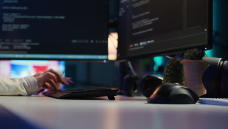 it specialist typing on pc keyboard, close up