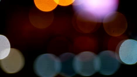 4k. abstract blur of bright bokeh from car on street lights. abstract glitter defocused colorful light background