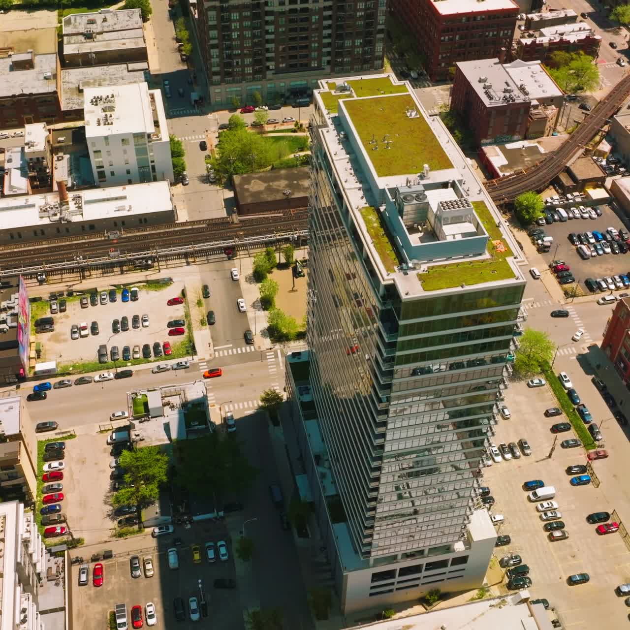 Numerous parking lots around the high multi-storied building. Aerial view on the residential area of Chicago