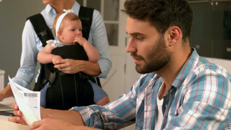 stressed father calculating bills