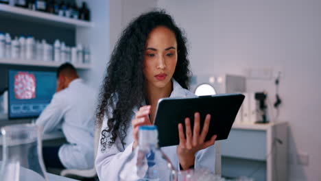 Tablet,-research-and-woman-scientist-in-lab