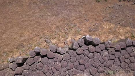 aerial looks straight down onto tops of basalt columns in wa scablands