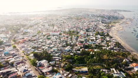 Scenic-View-of-Mui-Ne-Urban-City-with-Beach-and-Boats