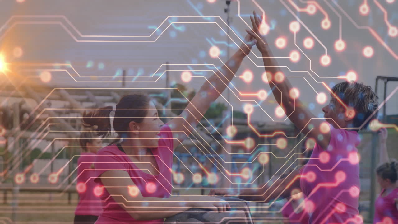 Animation of people high-fiving with circuit board pattern overlaying scene