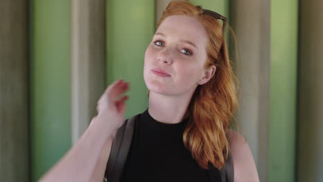 portrait of beautiful young woman smiling happy redhead freckles confident