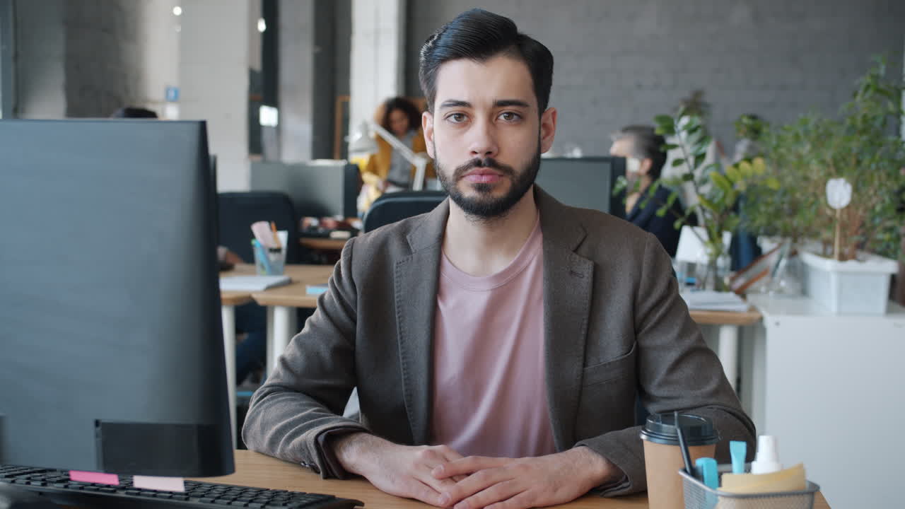Man in Office Sitting at Desk