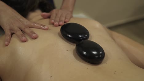 This-is-a-Hot-Stones-Massage-treatment-in-a-beauty-salon