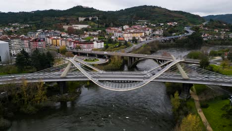 slow trucking pan around unique curved architecture of millennium bridge miño river in ourense, galicia, spain