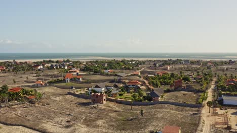 drone crane motion reveal macapa village on brazilian coastline in sunlight