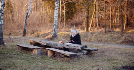 Woman-Writing-Message-On-Cell-Phone-During-Trip