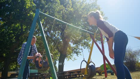 family playing in the playground 4k