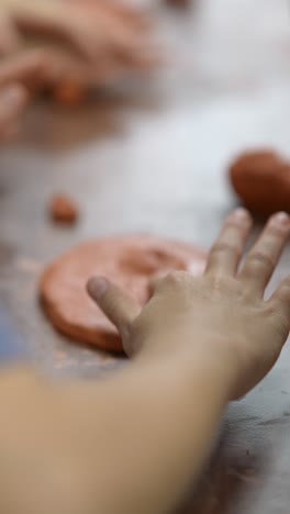 children working with clay