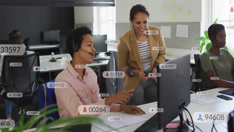 Animation-of-notification-bars-over-diverse-female-coworkers-discussing-on-desk-in-office