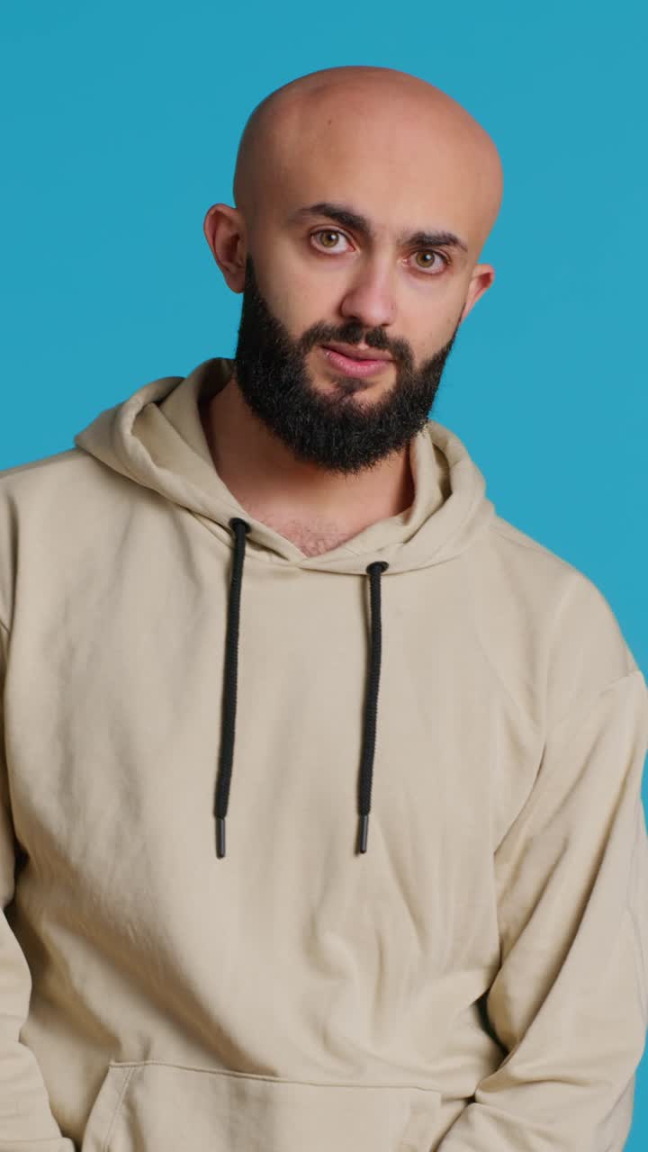 Vertical Video Arab person showing negative sign with fingers