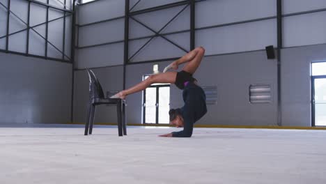 female gymnast performing at sports hall