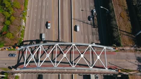 Aerial-of-cars-on-59-South-freeway-in-Houston,-Texas-on-a-bright-sunny-day