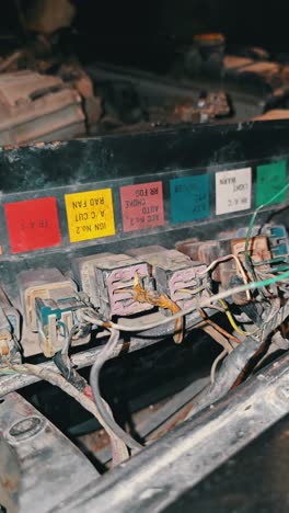 the engine and fuse box of a 90's nissan patrol suv showcasing its vintage mechanics