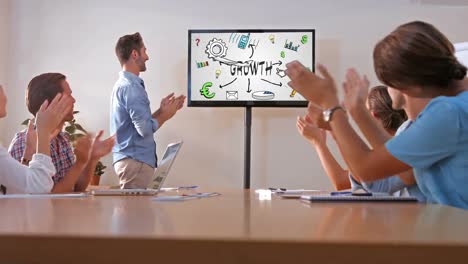 team of executives clapping at the presentation in the conference room