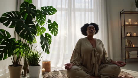 woman meditating at home