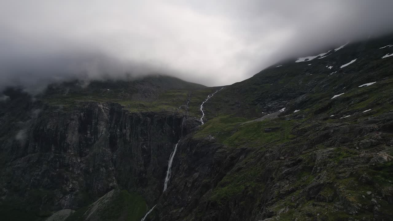 Majestic Waterfall cascading down a misty mountainside