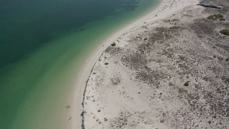 Scenic-coastline-of-Portugal,-turquoise-sea-and-white-sand-beach