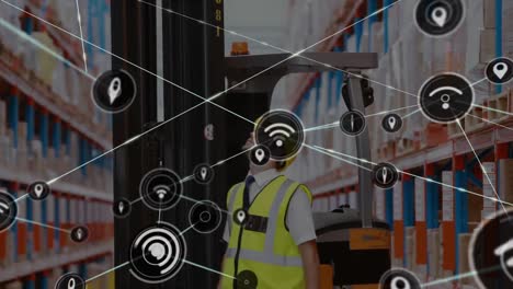 Animation-of-network-of-connections-with-icons-over-man-working-in-warehouse