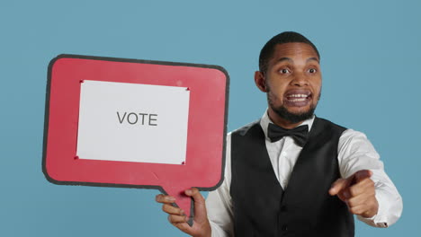 political bellboy hotelier showing a speech bubble with the message to vote