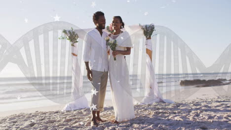 couple in wedding attire on beach with dna strand animation overlay