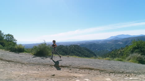 Blonde-woman-in-gym-outfit-is-jogging-uphill