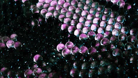 surface of densely spaced small round colored balls closeup