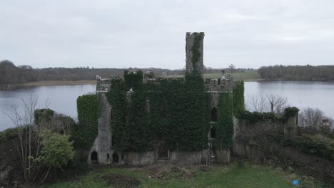 mcdermott castle ruins on an island in lough key, roscommon, serene lake surroundings drone footage