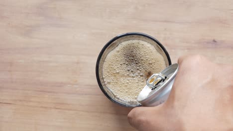 pouring soda into a glass