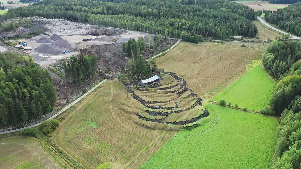 Large landslide near NCC operated open-pit construction rock quarry, dirt road and agricultural field and barn destroyed due to shifting soil. Heavy rains are suspected to contribute to the landslide.