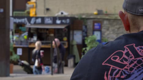 Over-the-Shoulder-Shot-of-Young-Family-In-Background-of-Bonn-Square-Oxford-02